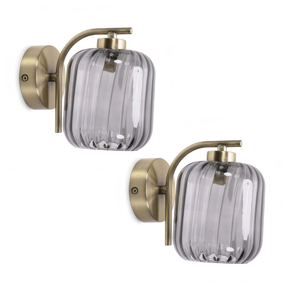 Pair of gold stem wall lights featuring ribbed glass shades in a smoky gray color, complete with LED bulbs for modern illumination.