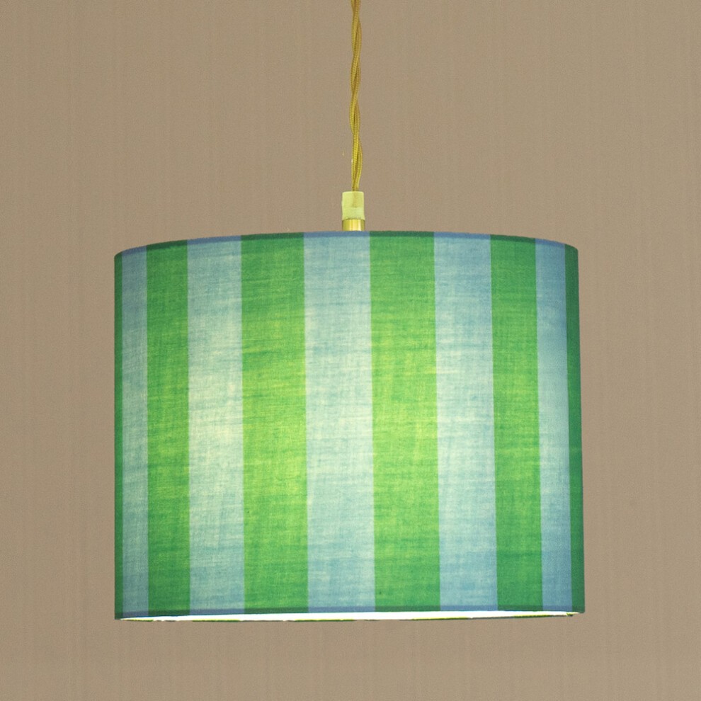 Large drum lamp shade featuring alternating blue and green stripes in a fabric material, suspended by a yellow cord against a neutral background.
