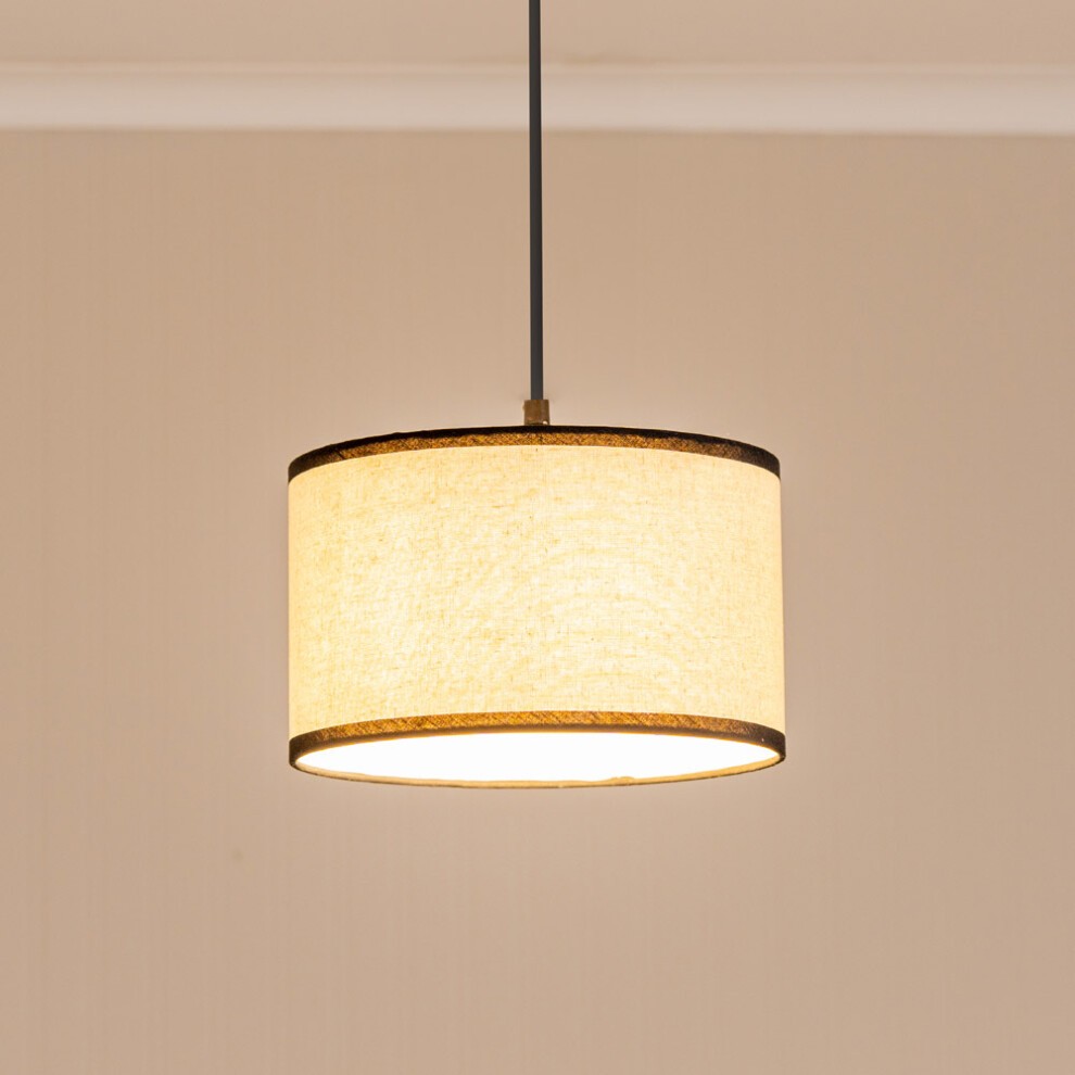 Natural linen fabric drum lamp shade in black with a light beige interior, featuring a sleek design and a simple, elegant finish, suspended from a black cord.