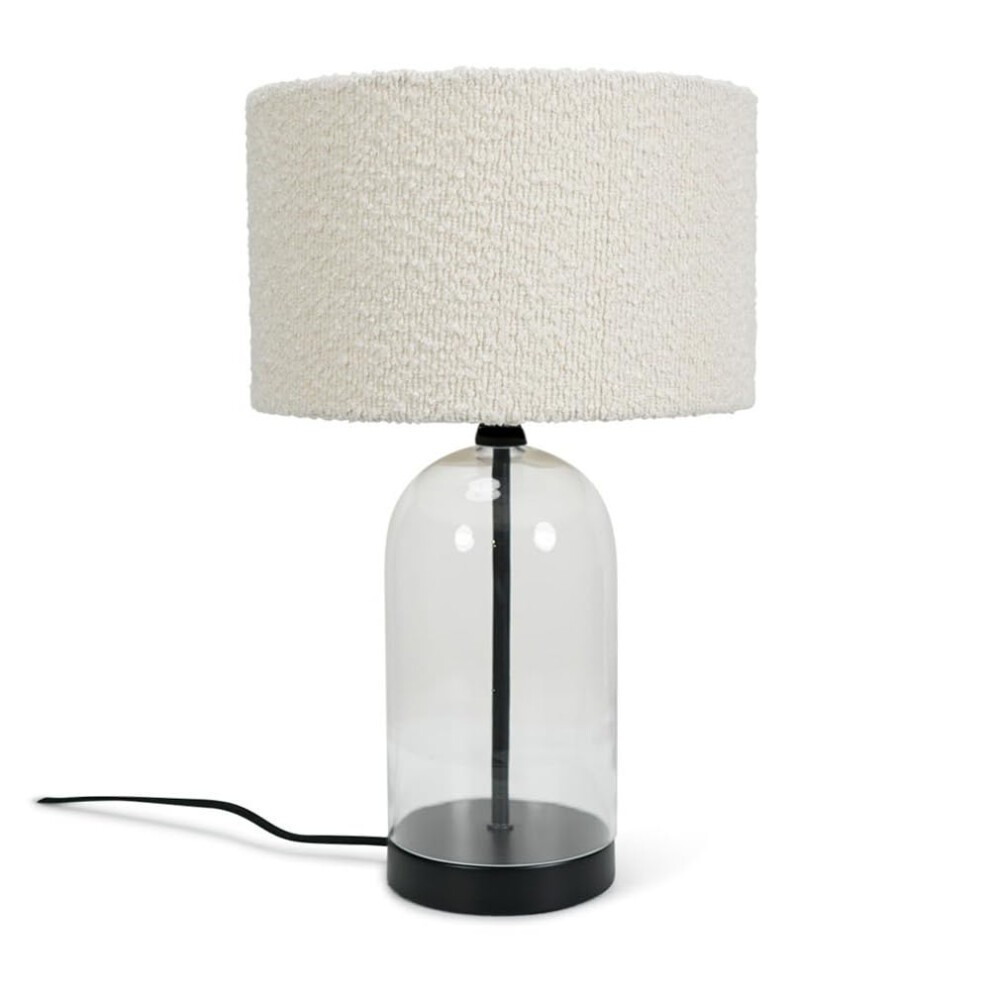 Glass and black metal table lamp featuring a cream boucle shade, with a rounded glass base and a sleek black stand, designed for LED light.