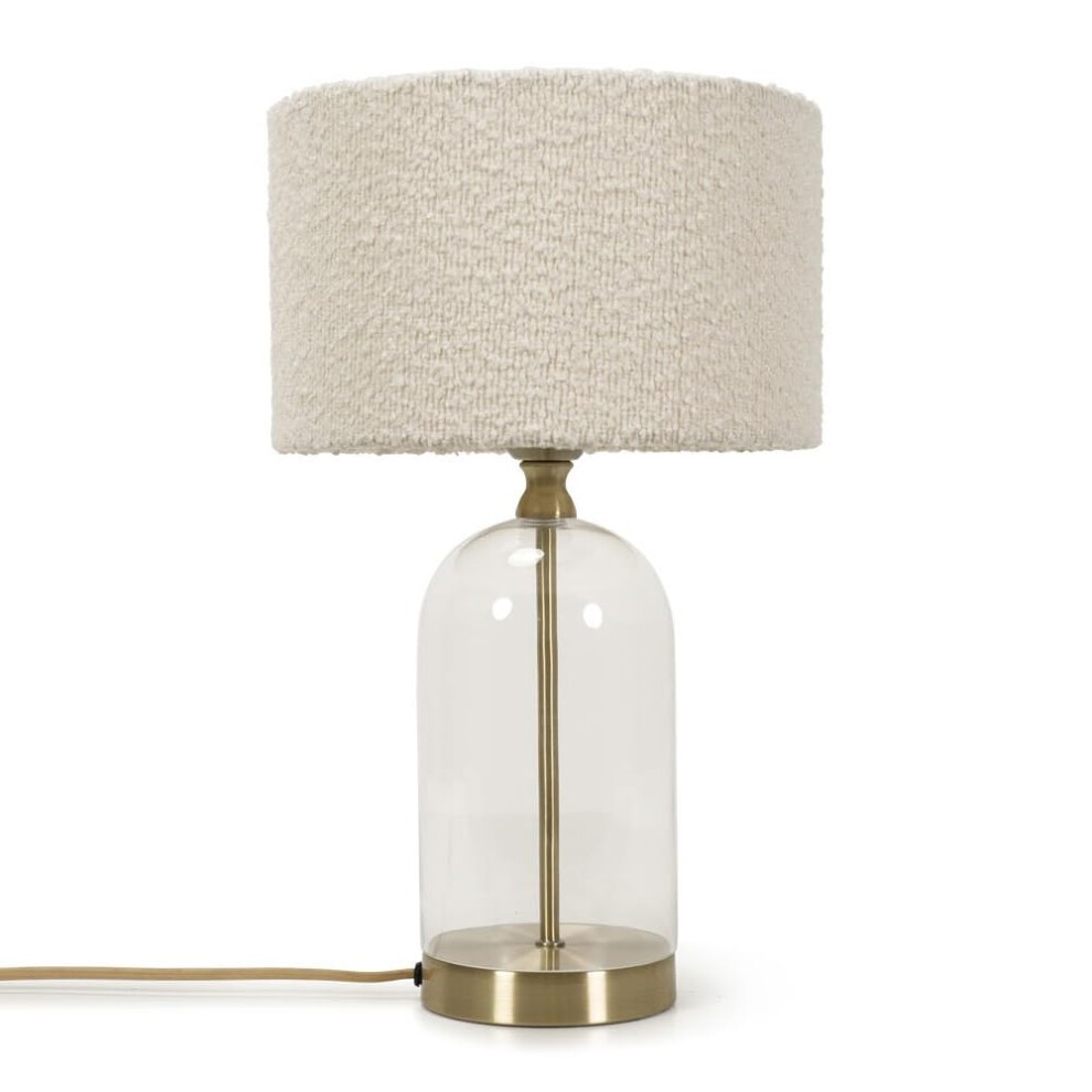 Elegant table lamp featuring a clear glass base, gold metal accents, and a textured cream boucle shade, designed for LED light.