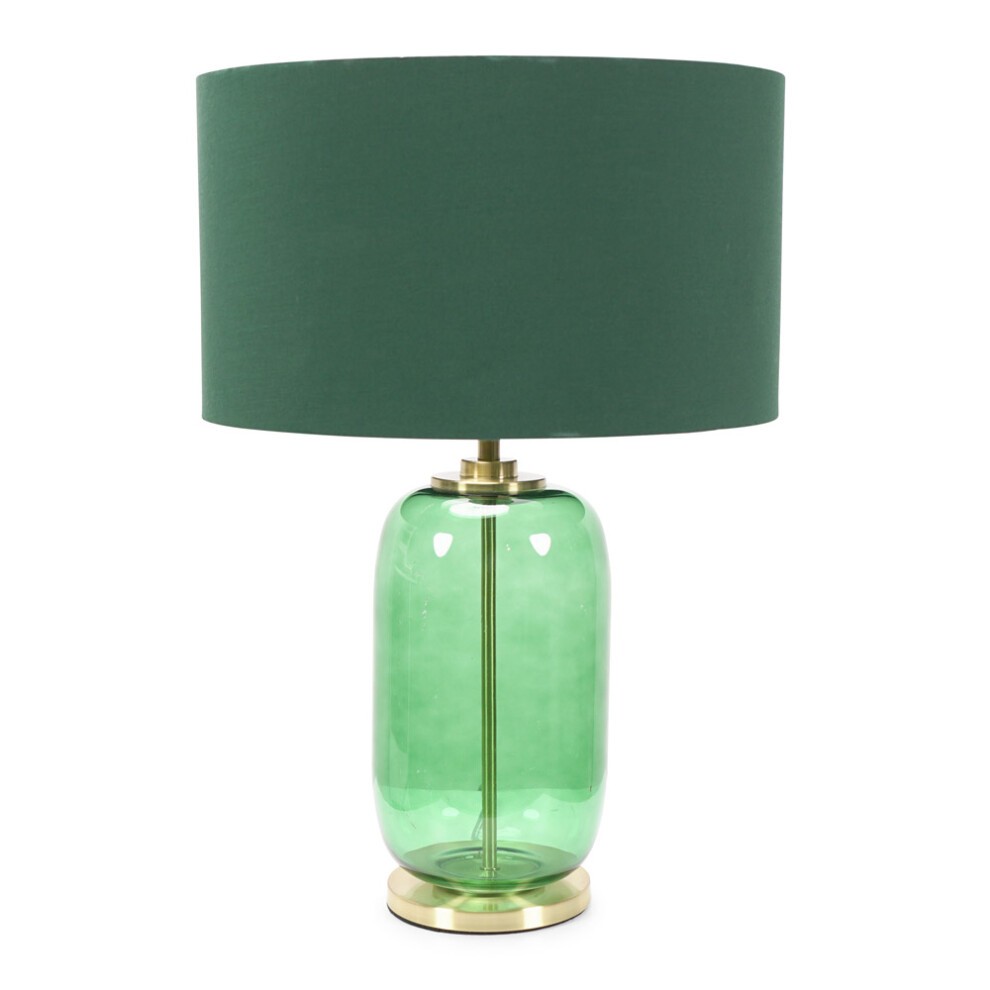 Forest green fabric drum shade atop a bottle green glass lamp base with gold trim, featuring a modern design and an included LED bulb.