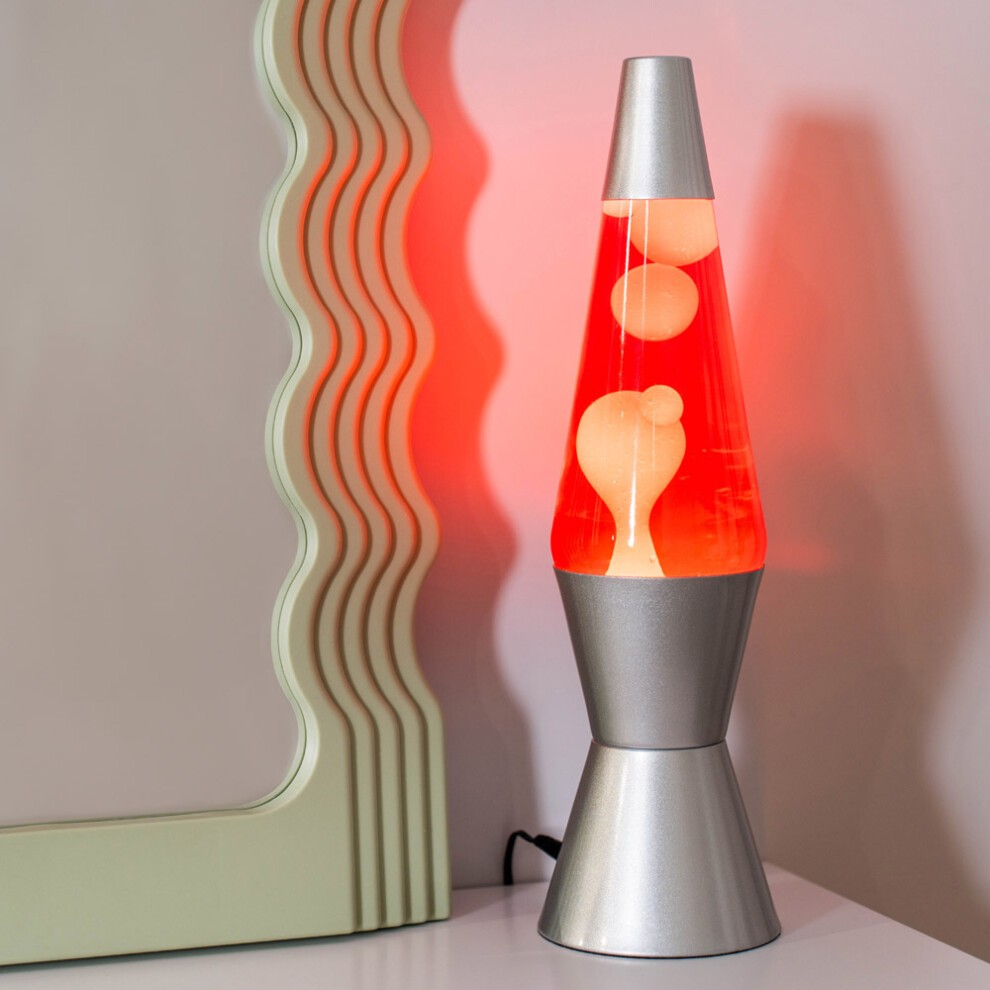 Retro lava lamp featuring a sleek silver base, white and pink lava, and a vibrant red liquid, perfect for desk or table lighting.