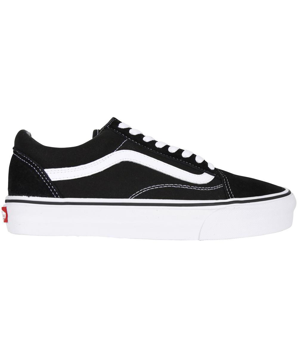 Black suede Old Skool shoe by Vans featuring a white side stripe, white laces, and a classic rubber sole with a black and white color scheme.