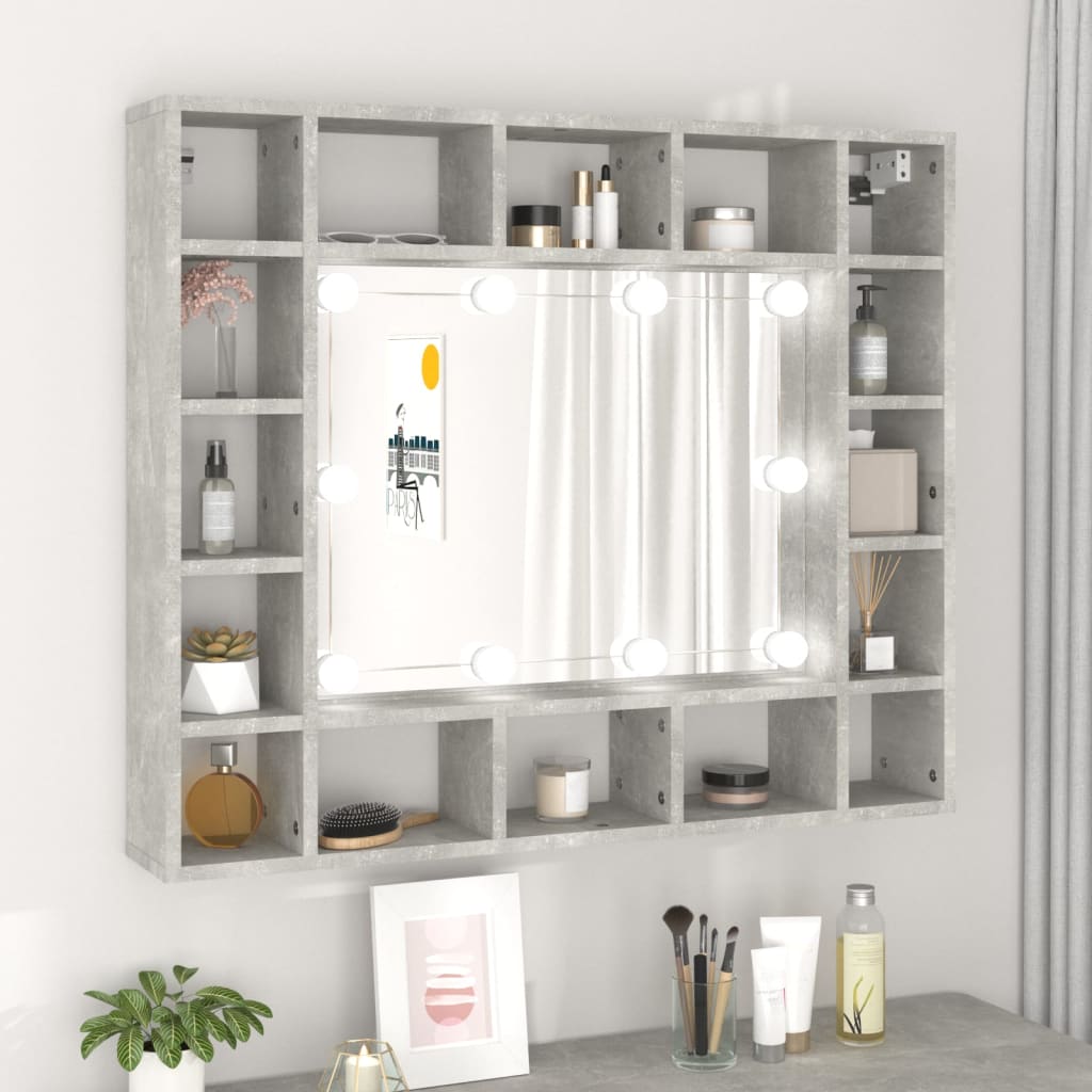 Concrete grey mirror cabinet featuring an LED cosmetic mirror, surrounded by open shelves for storage, showcasing various decorative and cosmetic items.