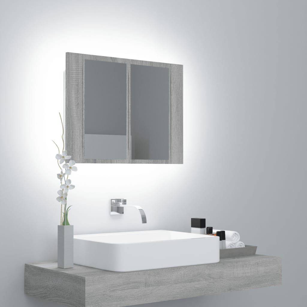 Grey Sonoma LED mirror cabinet made of engineered wood, featuring two mirrored doors, illuminated edges, and a sleek design above a minimalist sink with toiletries.