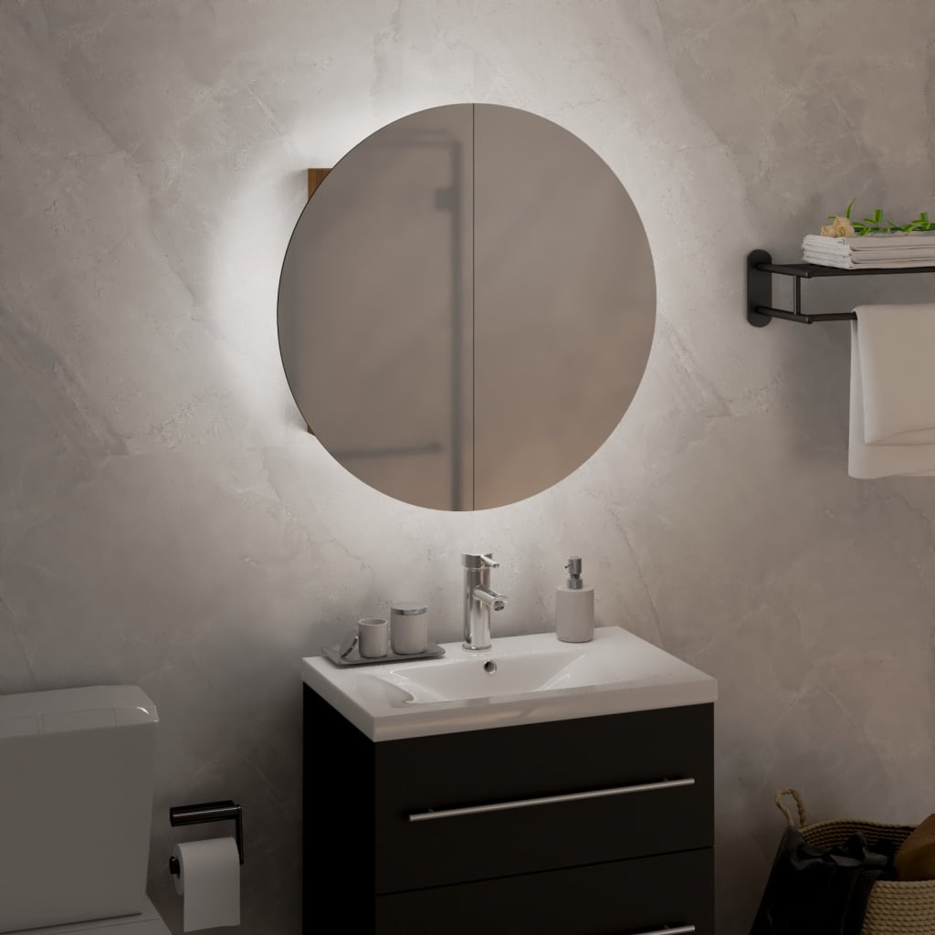 Oak bathroom cabinet with a sleek design, featuring a white ceramic sink, modern faucet, and a round mirror above, set against a light stone wall.