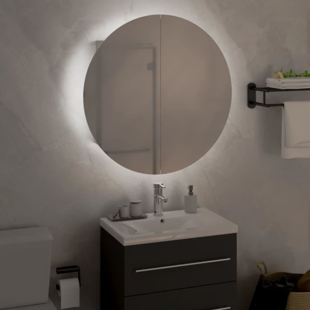 White engineered wood bathroom cabinet with a sleek design, featuring two drawers, a round mirror above, and a modern faucet on a white countertop.