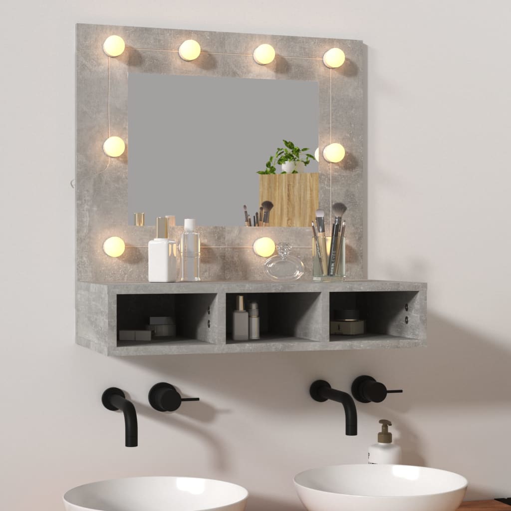 Concrete grey mirror cabinet featuring a central mirror surrounded by LED lights, with two open storage compartments below for toiletries and cosmetics.
