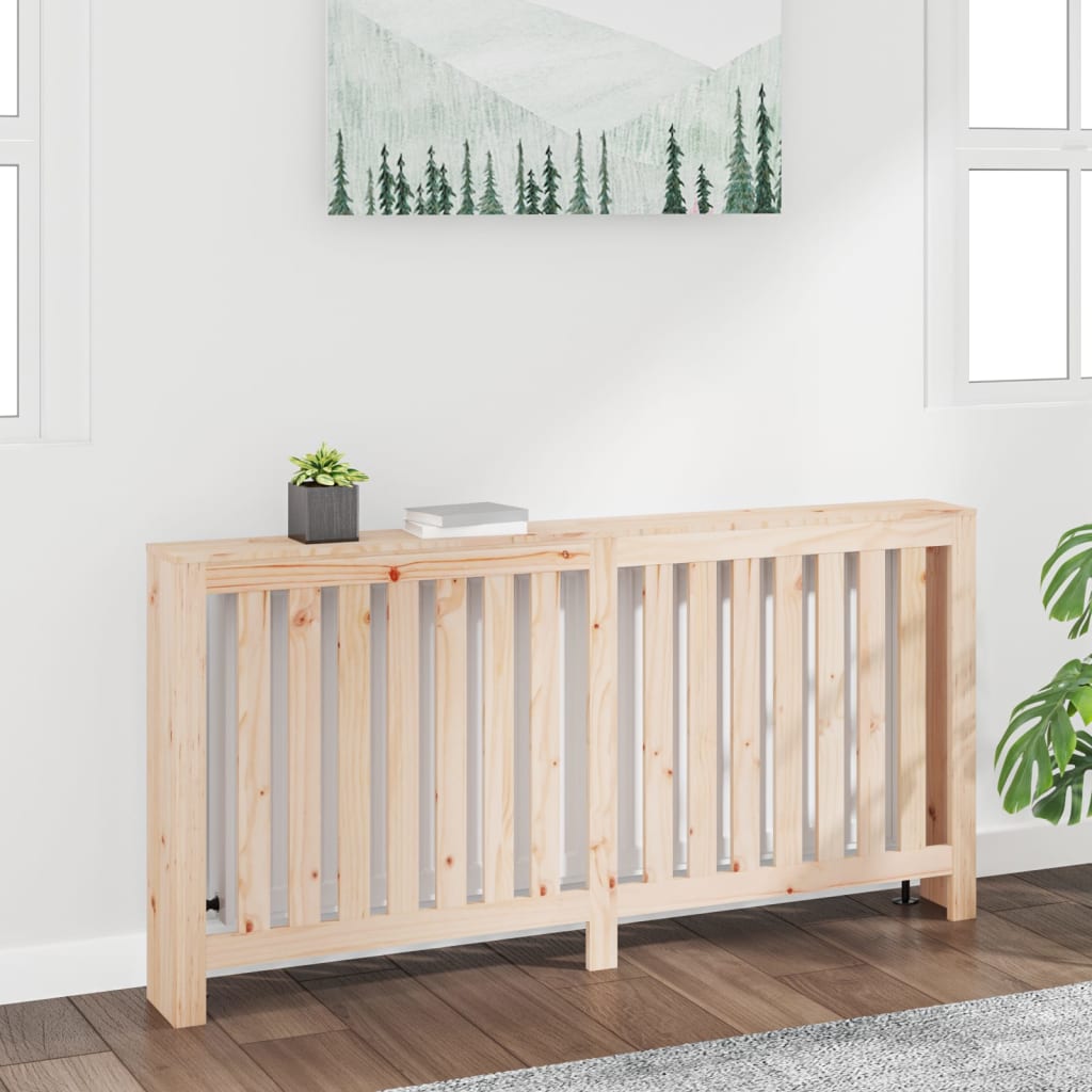 Solid wood pine radiator cover in a light natural finish, featuring vertical slats, a flat top for display, and a minimalist design, set against a bright, airy room.