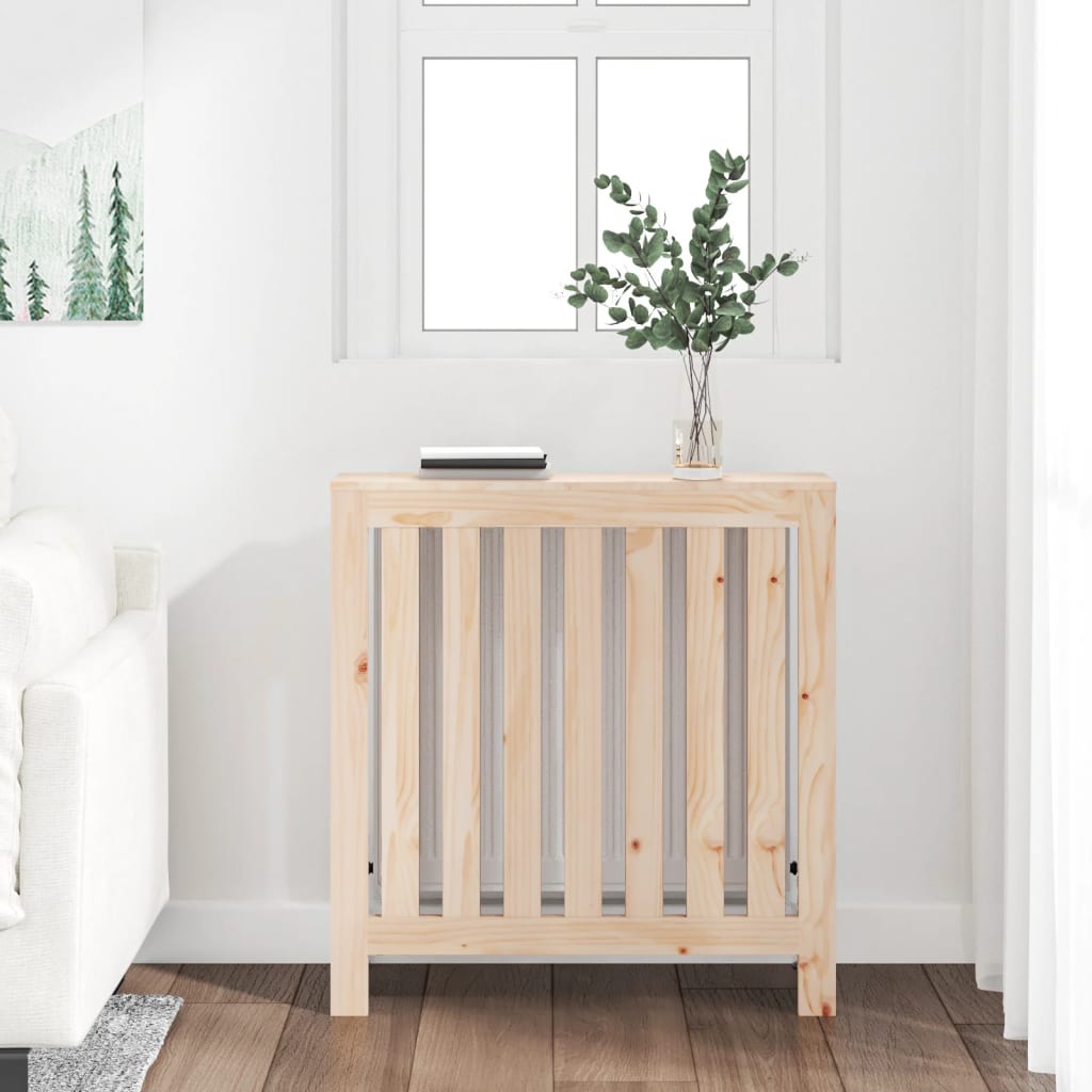 Solid wood pine radiator cover in brown, measuring 79.5x19x84 cm, featuring slatted design and placed near a window with a plant and book on top.
