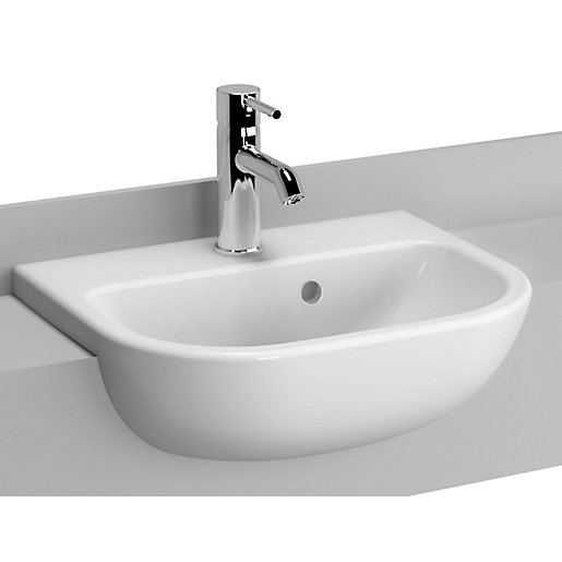 White ceramic semi-recessed basin with rounded edges, featuring a single tap hole and a sleek chrome faucet, designed for modern bathroom aesthetics.