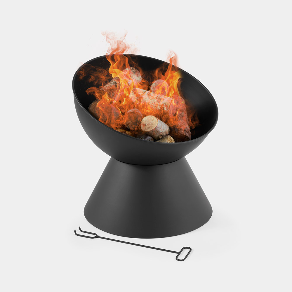 Black raised bowl fire pit with a conical base, featuring vibrant flames and logs inside, accompanied by a metal poker tool.