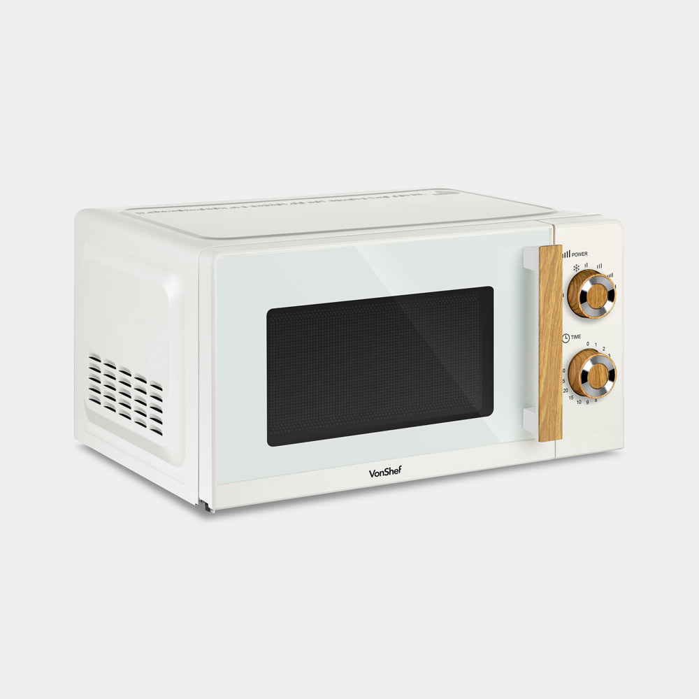 Cream-colored microwave with a wooden handle and knobs, featuring a black glass door and a sleek, modern design by Vonhaus.