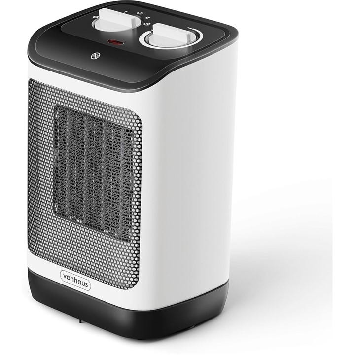 White PTC space heater with a black top, featuring two control knobs and a mesh front for airflow, designed for efficient heating at 2000W by VonHaus.