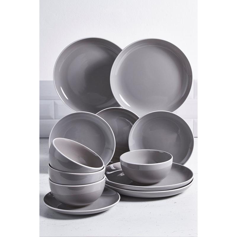 Twelve-piece dinner set in two-tone grey and white, featuring smooth ceramic plates and bowls with a modern, minimalist design.