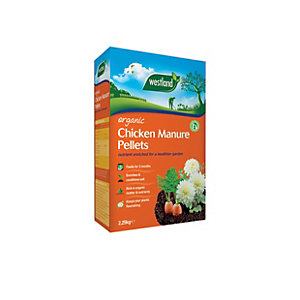 Green and white box of Westland Organic Chicken Manure Pellets, 2.25kg, featuring a garden scene with flowers and vegetables, emphasizing organic gardening benefits.