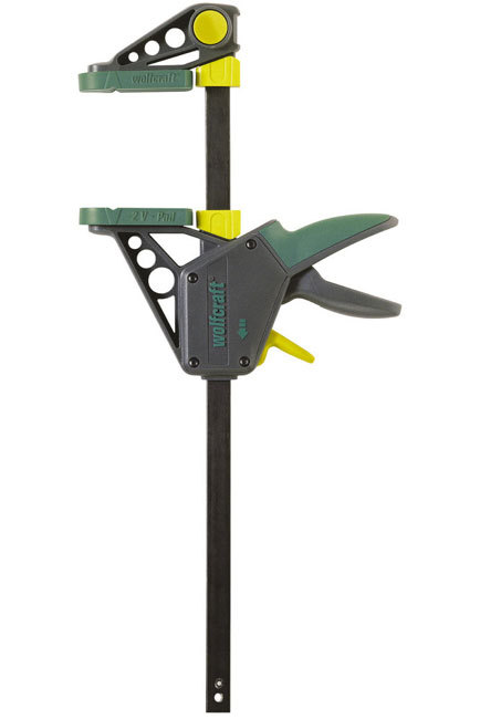 One-handed clamp in green and gray plastic with yellow accents, featuring a 300mm span and 120kg force, designed for easy one-handed operation and secure gripping.