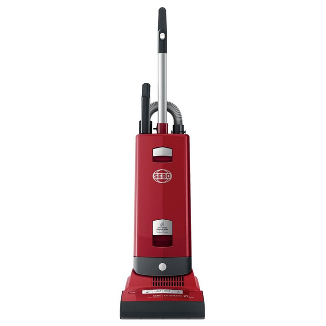Red Sebo 91503GB X7 upright vacuum cleaner with a sleek design, featuring a silver logo, adjustable handle, and a wide cleaning head for efficient dirt removal.