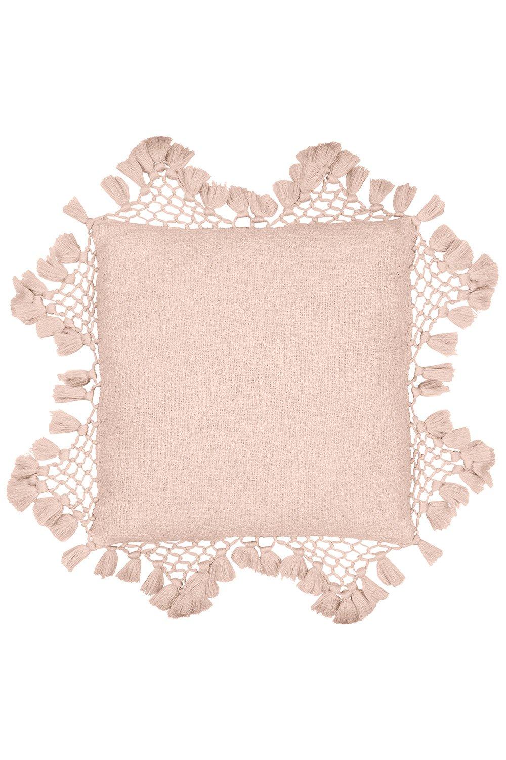 Blush cotton cushion with a textured surface, featuring a macrame tassel border, adding a soft and decorative touch to any space.