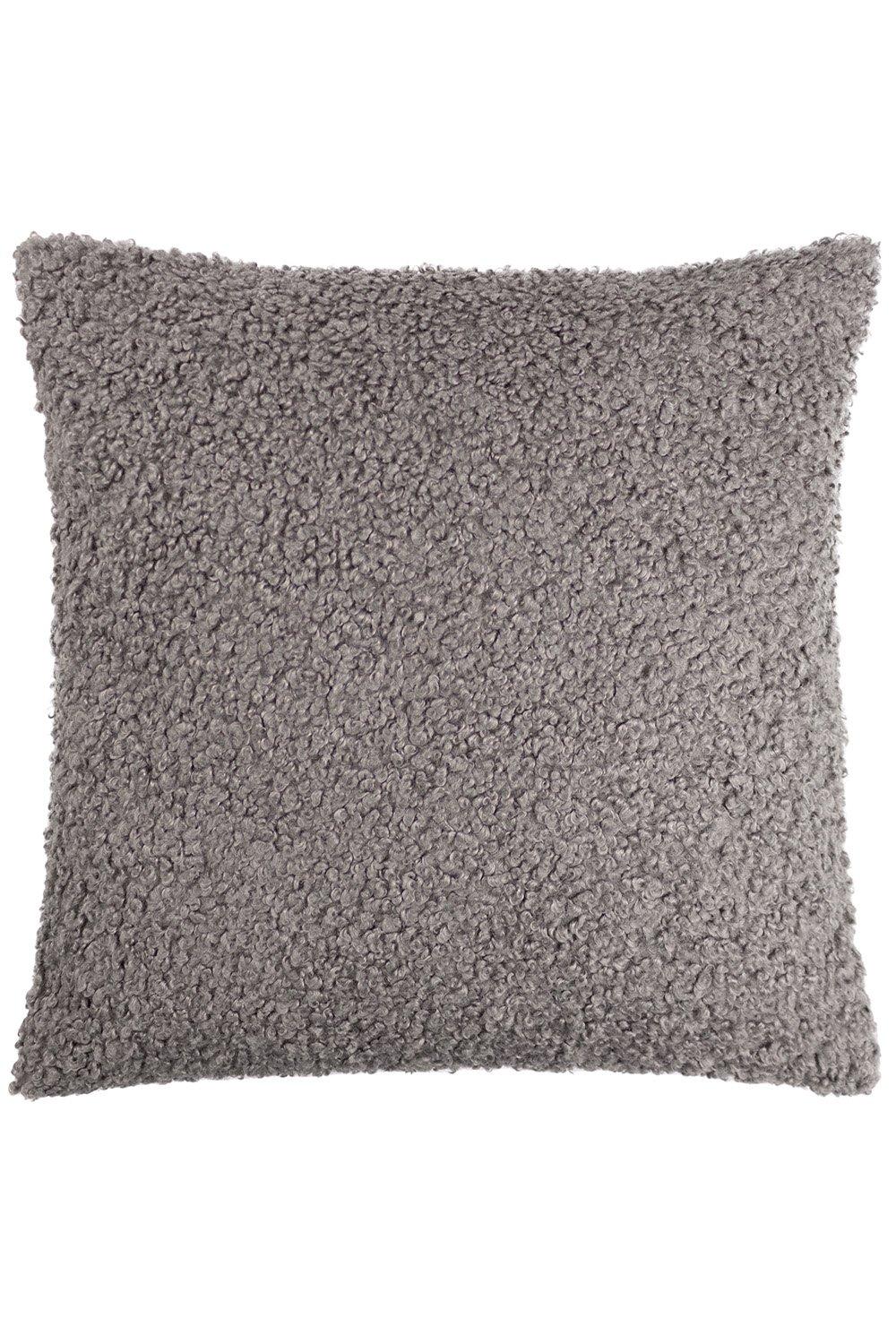 Dark grey boucle cushion with a chunky texture, featuring a soft, fuzzy surface and square shape, designed for comfort and style in home decor.