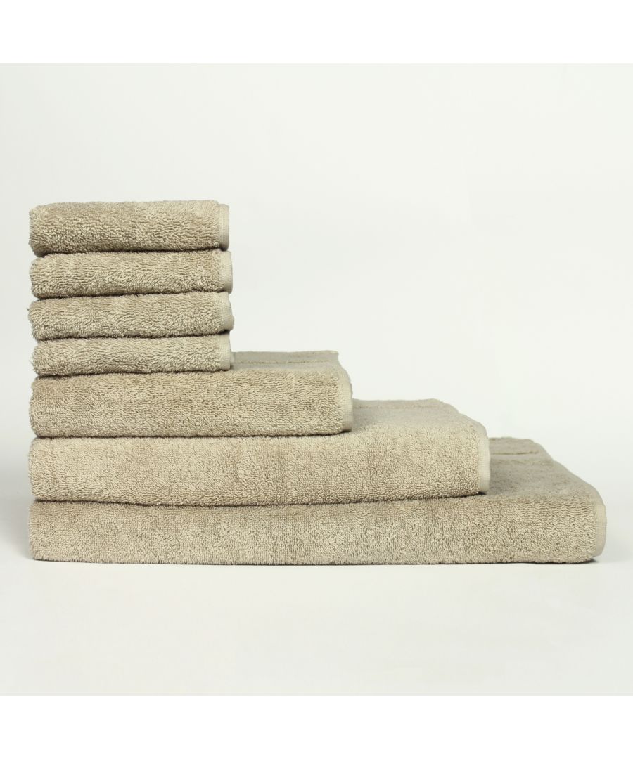 Beige cotton towel bale featuring stacked towels in various sizes, showcasing a soft, plush texture and a neutral color palette, ideal for bathroom use.