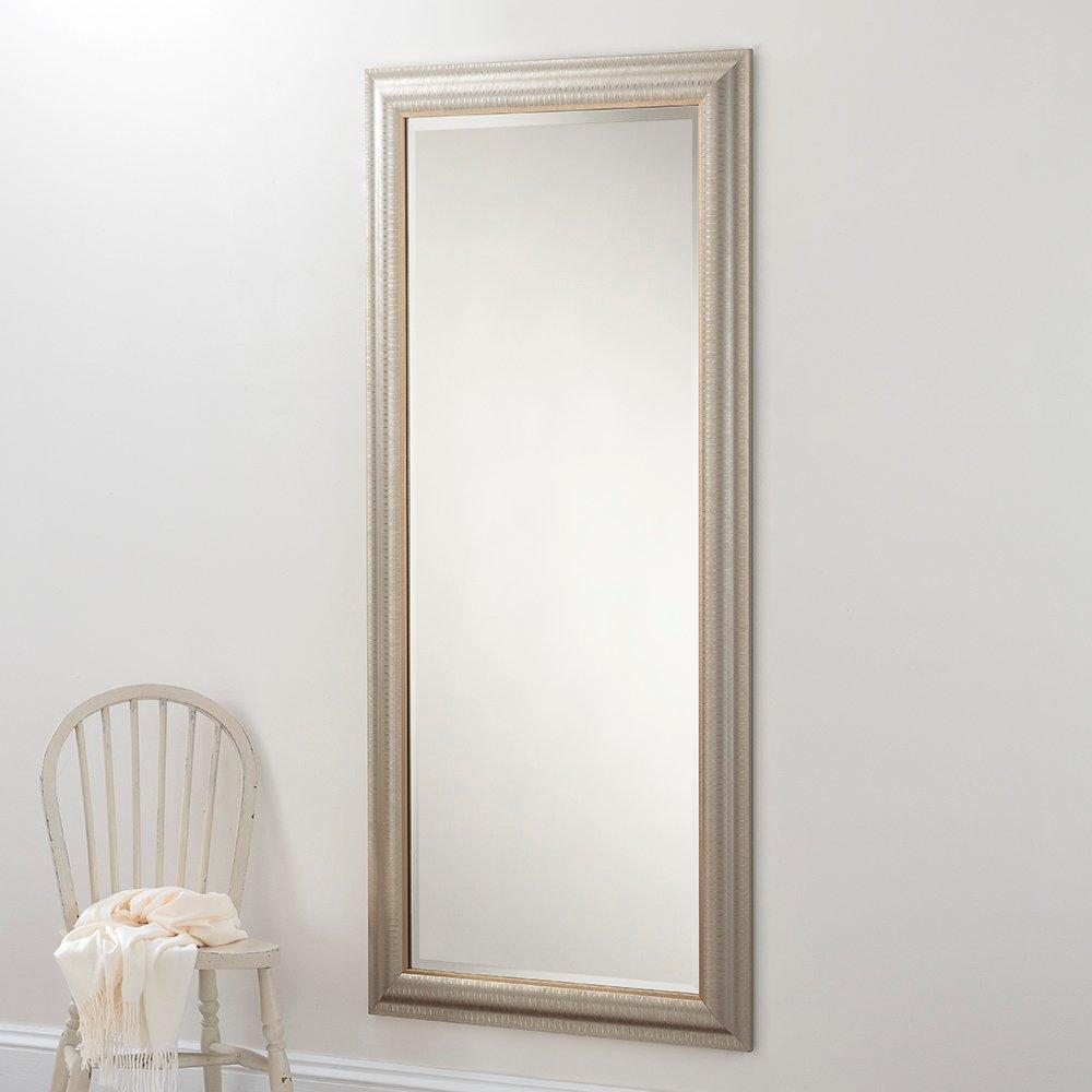 Textured champagne full-length mirror in gold, measuring 168.5x77cm, featuring an ornate frame and a sleek reflective surface, positioned beside a white wooden chair.