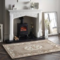 Beige Shensi rug 150x240cm with intricate floral patterns and ornate border, placed in front of a white fireplace.