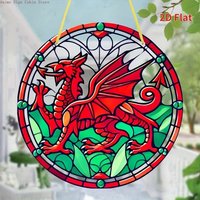 Round acrylic sign with red Welsh dragon design, stained glass style, green leaves, hanging by a yellow string.