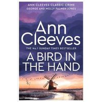 "A Bird in the Hand book by Ann Cleeves, featuring a windmill under a purple sky on the cover"