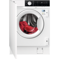 White AEG integrated washer dryer with black control panel, silver dial, and open door revealing red clothing inside.