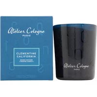Atelier Cologne Clementine California candle in dark blue glass with matching blue box featuring white text.