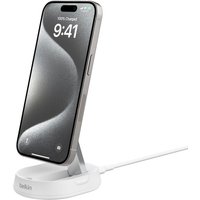 White Belkin BoostCharge Pro wireless charger with smartphone docked, featuring sleek design and fast charging capability.