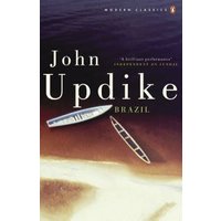 "Book cover of 'Brazil' by John Updike, featuring a beach scene with two boats on sand and a dark sky."