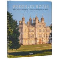 "Burghley House book with ornate castle cover, blue sky background, and gold title text on spine and front."