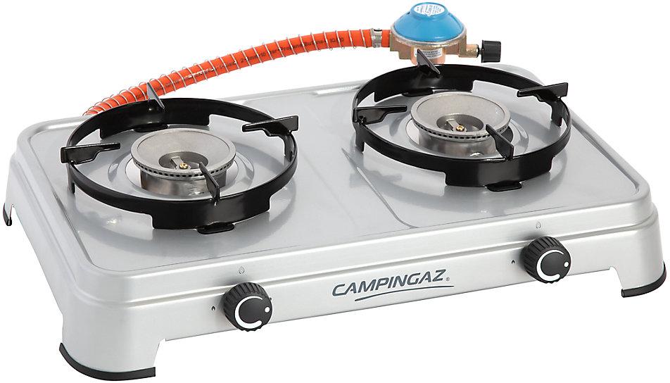 Campingaz double burner stove with black grates, silver body, orange gas hose, and blue regulator.