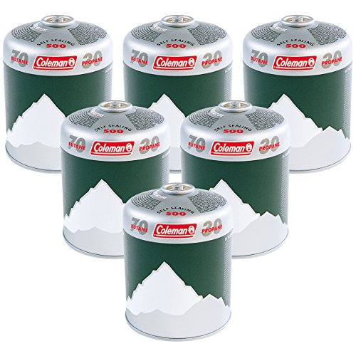 Six green and silver Coleman C500 gas cartridges, featuring a mountain design, labeled with "Coleman" and "500," designed for camping and outdoor use.