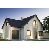 White two-story house with dark roof, large windows, and a garage, set against a twilight sky.