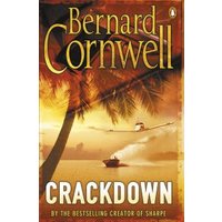 "Crackdown book by Bernard Cornwell, cover with palm trees, sunset, and a boat on water"