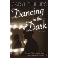 "Dancing in the Dark" novel by Caryl Phillips, silhouette of man in hat, lit mirror on dark cover.