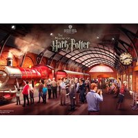 Red steam train in a bustling station with people, arched roof, and large clock, themed "The Making of Harry Potter".