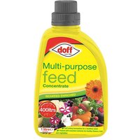Yellow Doff Multi Purpose Plant Feed Concentrate bottle with red cap and colorful plant images on label.