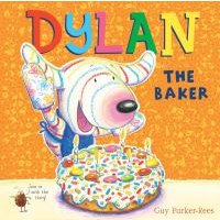 "Dylan the Baker children's book with colorful cover featuring a cartoon dog holding a cake with candles and sprinkles"