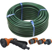 Green PVC reinforced hose coiled with orange and black spray gun, includes multiple fittings.