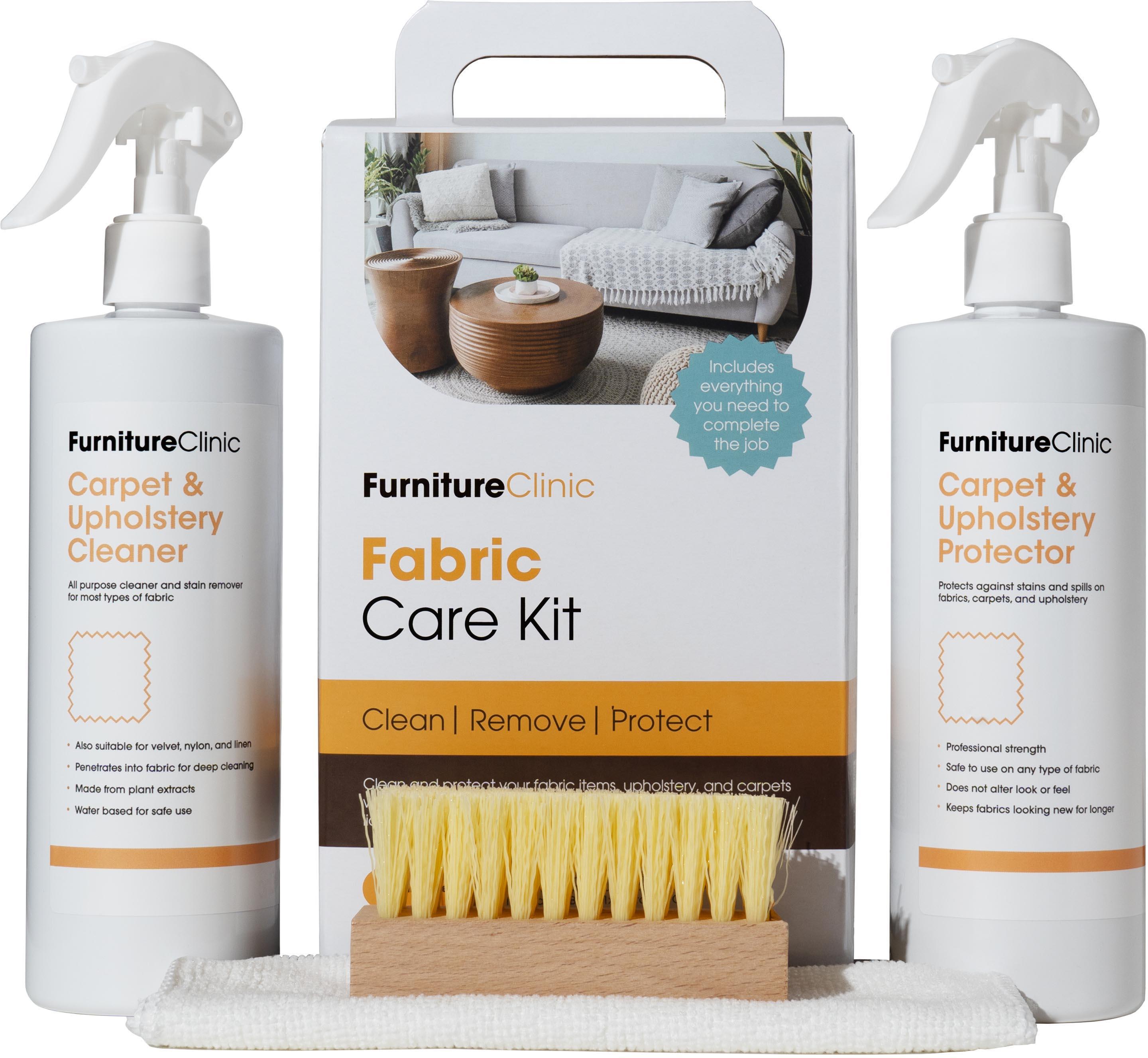 Furniture Clinic Fabric Care Kit with two spray bottles, carpet cleaner, upholstery protector, and a yellow bristle brush.