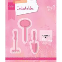 Pink Marianne Design "Garden" die set with shovel, rake, and sign shapes on a floral background.