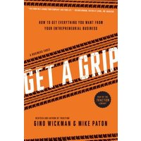 Orange book titled "Get a Grip" by Gino Wickman & Mike Paton, featuring bold white text and diagonal tire tread design.