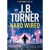 "Hard Wired book cover with cityscape, silhouette of running man, and bold title text by J.B. Turner"