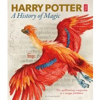 "Harry Potter: A History of Magic book with a vibrant red and orange phoenix illustration on the cover"