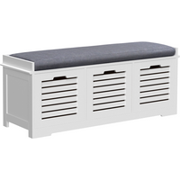 White HOMCOM shoe storage bench with three slatted doors, cushioned seat, and elevated base.